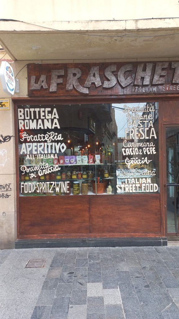 rotulación a mano de lettering en cristal de restaurante italiano en Barcelona